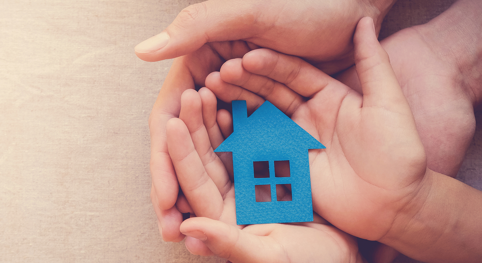 WFS-Home-Protection hands holding paper house, family home, homeless shelter, intern
